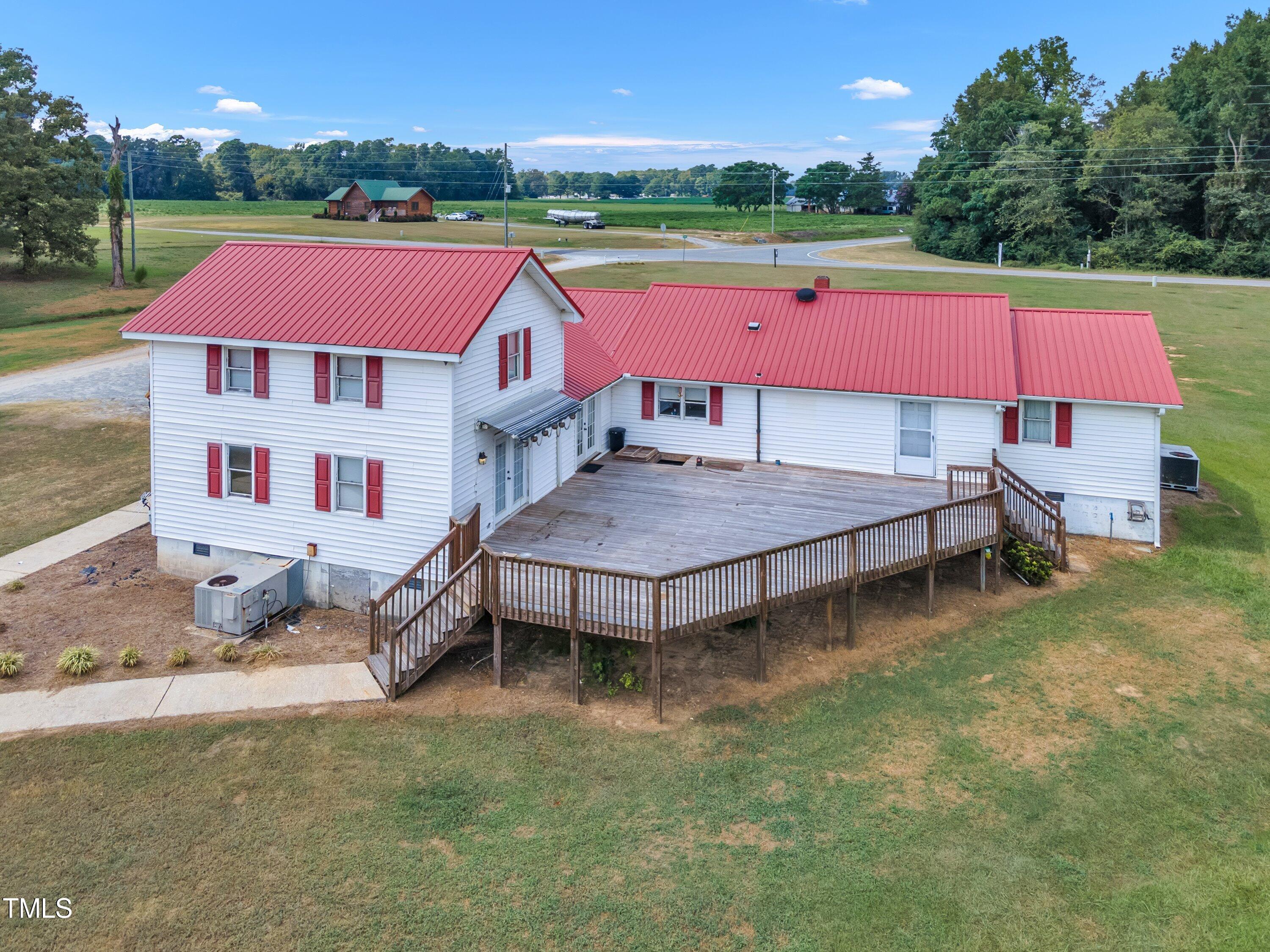 8585 Stricklands Crossroads Road Four Oaks, NC 27524 - Photo 29 of 30 an aerial view of a house with pool and a fountain