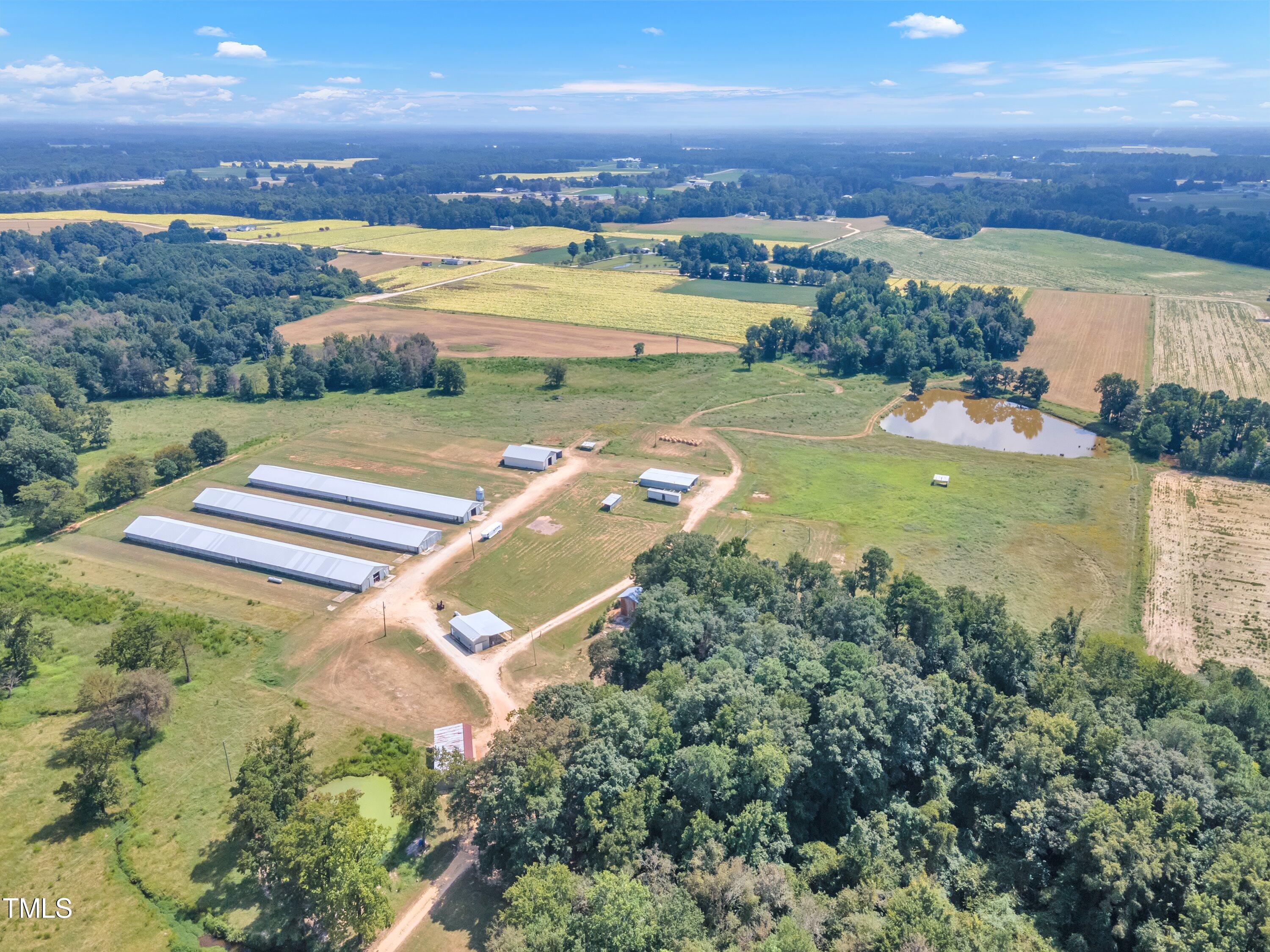 8585 Stricklands Crossroads Road Four Oaks, NC 27524 - Photo 4 of 30 an aerial view of a city