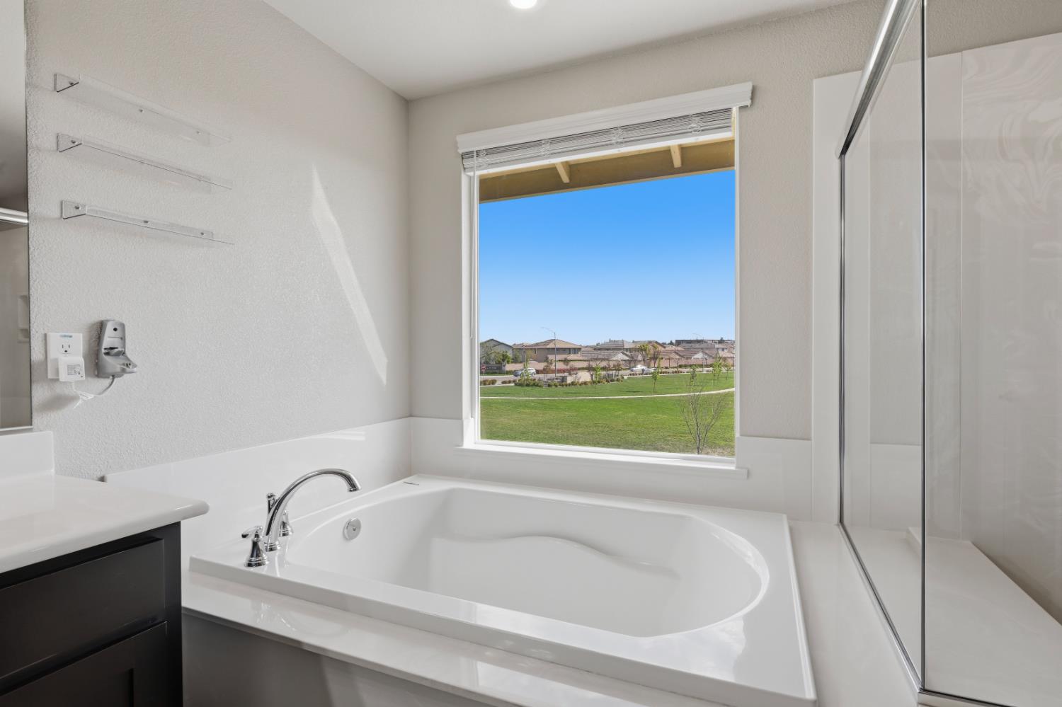 2012 Van Ruiten Drive Lodi, CA 95242 - Photo 30 of 49 a bathroom with a tub and a sink