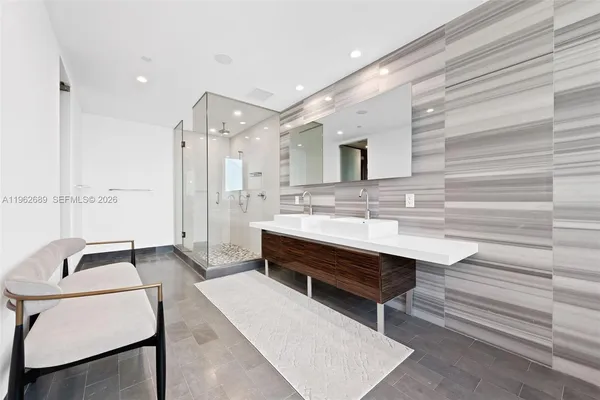 a white toilet sitting next to a shower