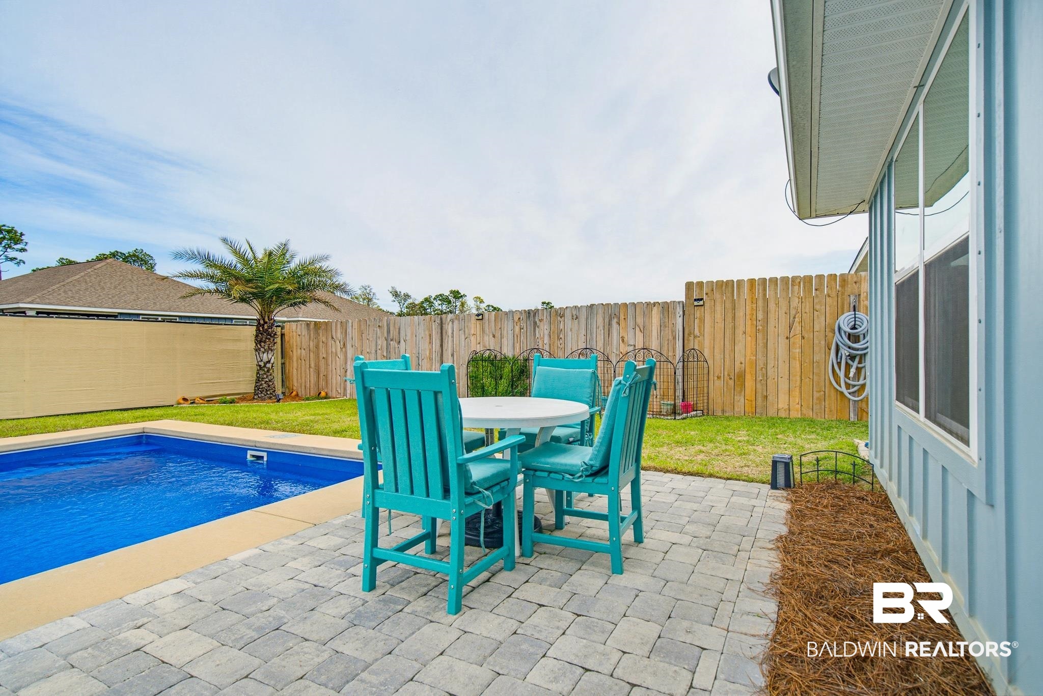 261 Fulham Lane Foley, AL 36535 - Photo 43 of 50 Fenced backyard featuring a patio and outdoor dining area