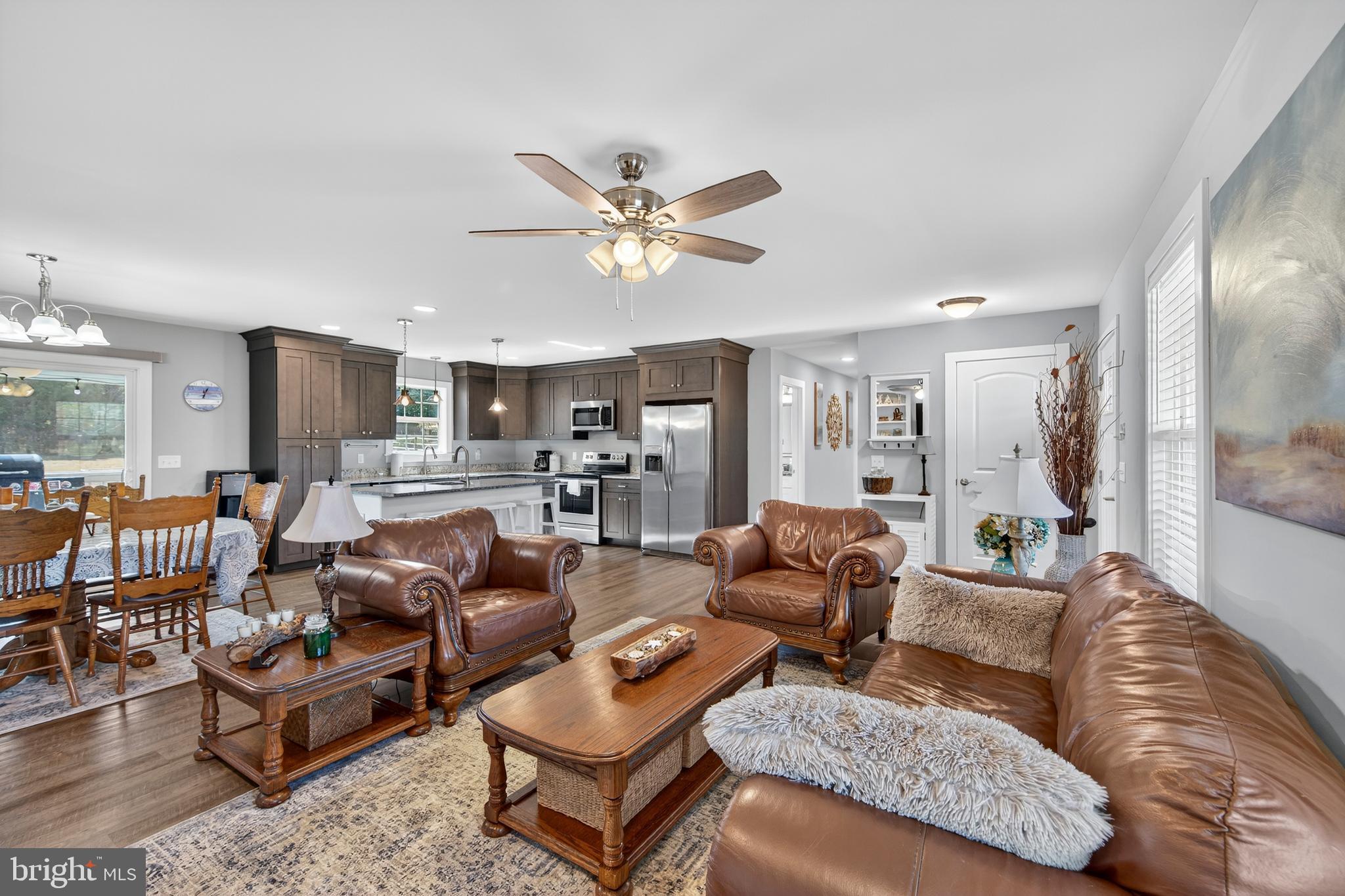 26356 Pennfields Drive Orange, VA 22960 - Photo 11 of 58 a living room with furniture kitchen view and a chandelier