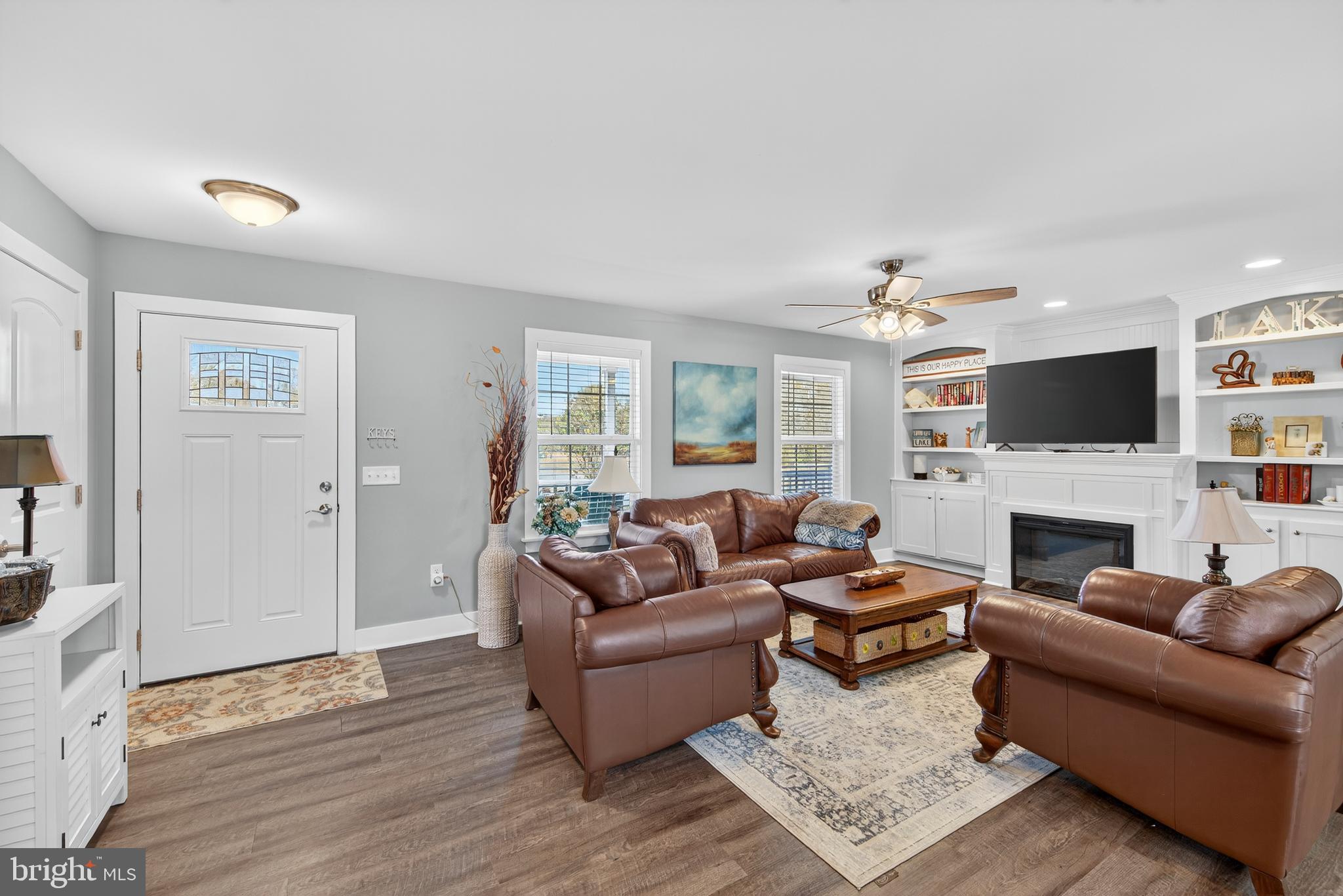 26356 Pennfields Drive Orange, VA 22960 - Photo 13 of 58 a living room with furniture a fireplace and a flat screen tv