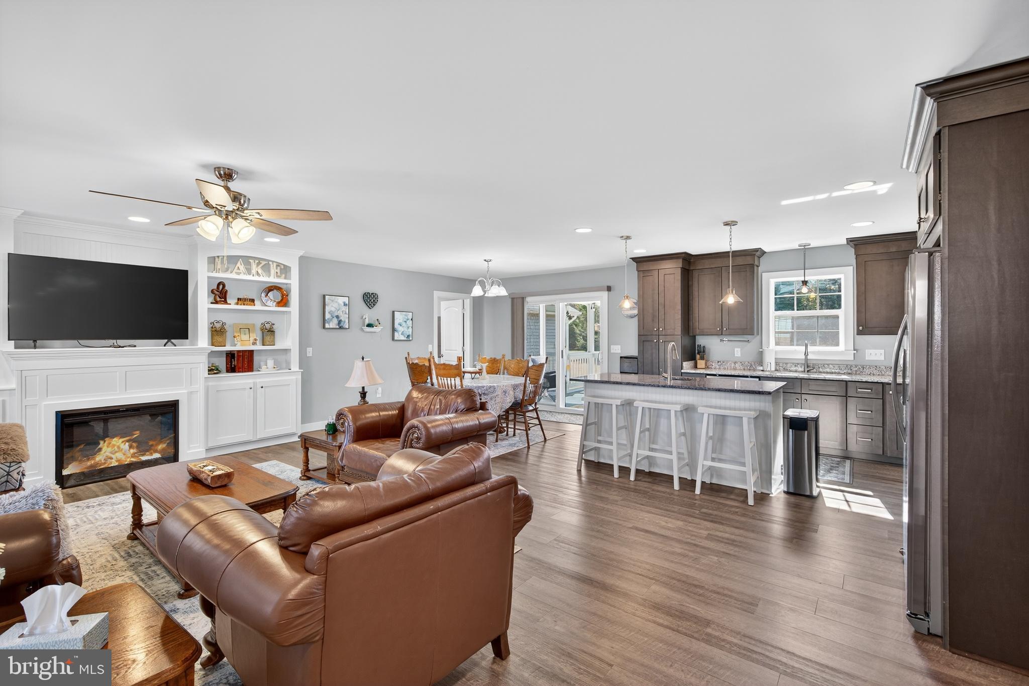 26356 Pennfields Drive Orange, VA 22960 - Photo 14 of 58 a living room with furniture a fireplace and a flat screen tv