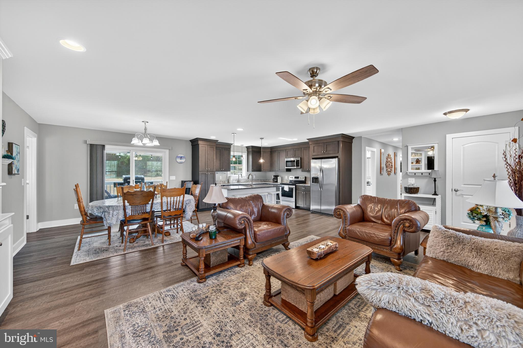 26356 Pennfields Drive Orange, VA 22960 - Photo 15 of 58 a living room with furniture kitchen view and a chandelier