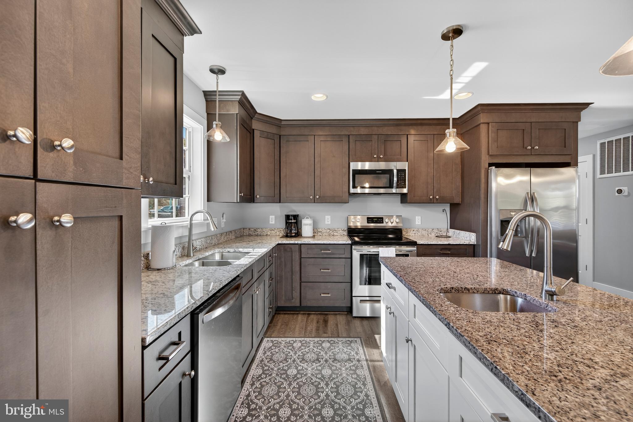 26356 Pennfields Drive Orange, VA 22960 - Photo 17 of 58 a kitchen with stainless steel appliances granite countertop a sink stove and refrigerator