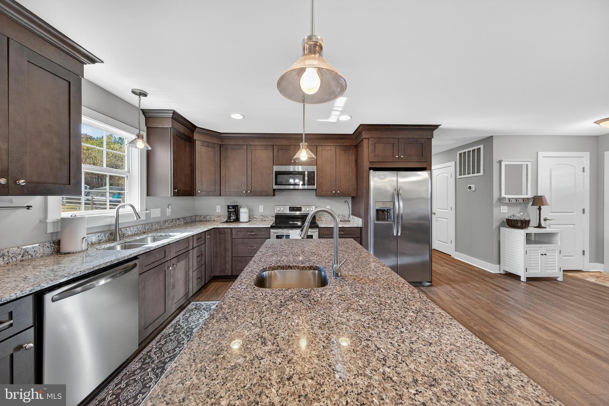 26356 Pennfields Drive Orange, VA 22960 - Photo 18 of 58 a large kitchen with kitchen island a sink stainless steel appliances and cabinets