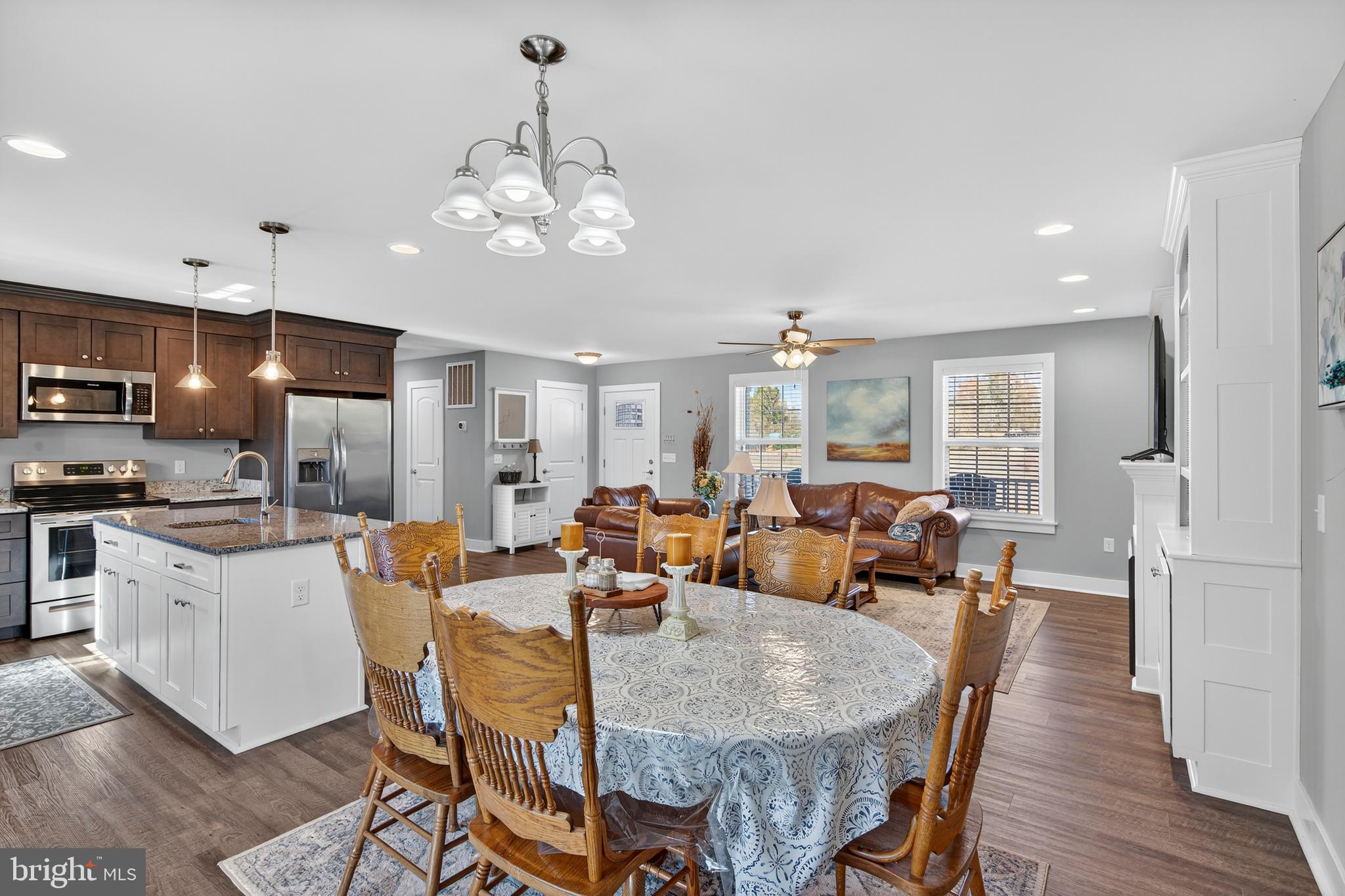 26356 Pennfields Drive Orange, VA 22960 - Photo 20 of 58 a view of a dining room with furniture a chandelier and wooden floor