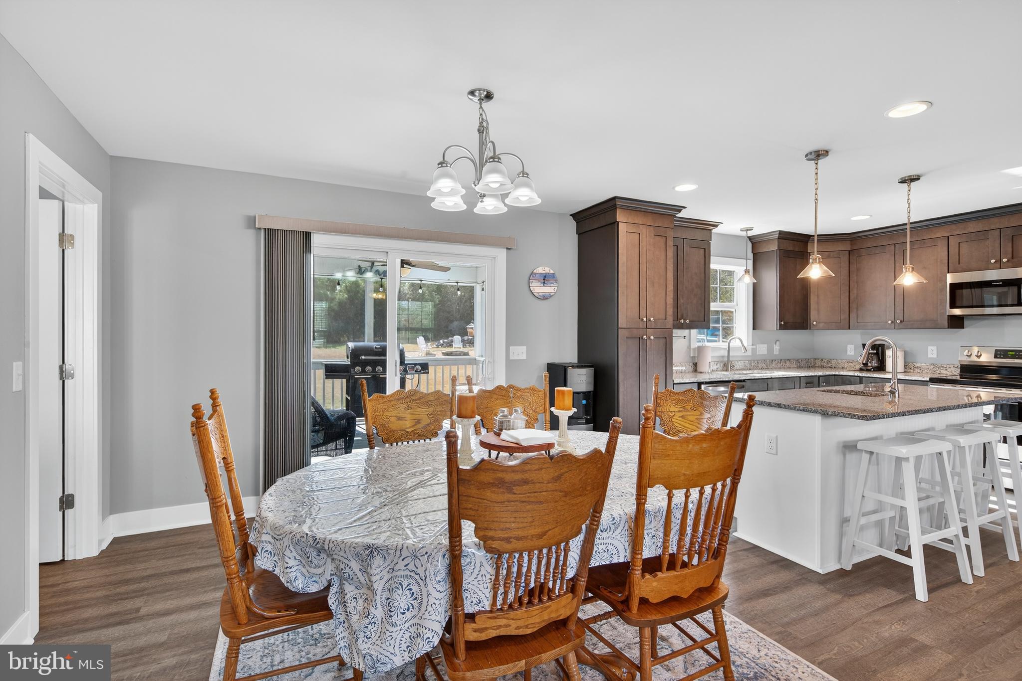 26356 Pennfields Drive Orange, VA 22960 - Photo 21 of 58 a dining room with furniture a chandelier and wooden floor