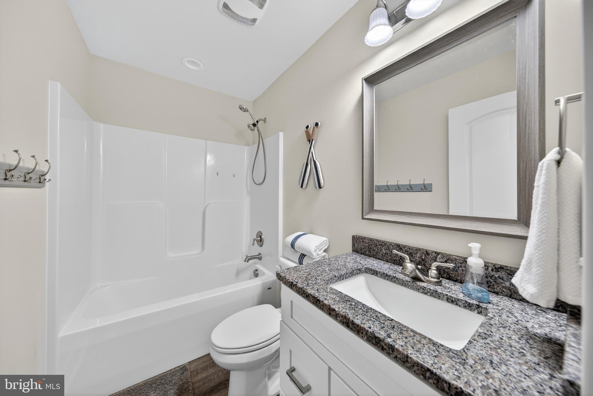 26356 Pennfields Drive Orange, VA 22960 - Photo 34 of 58 a bathroom with a granite countertop sink toilet and shower