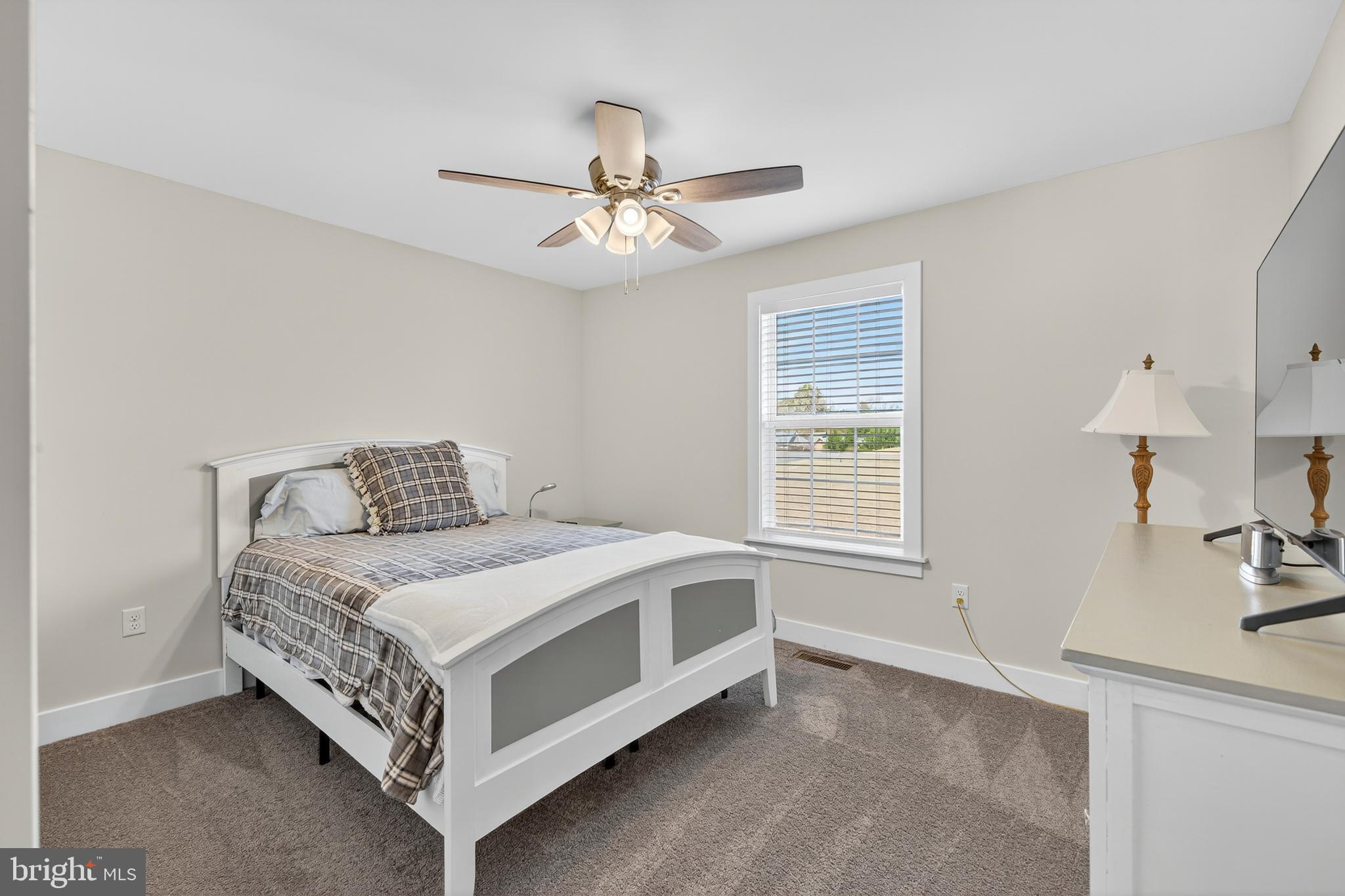 26356 Pennfields Drive Orange, VA 22960 - Photo 35 of 58 a spacious bedroom with a bed and a table in it
