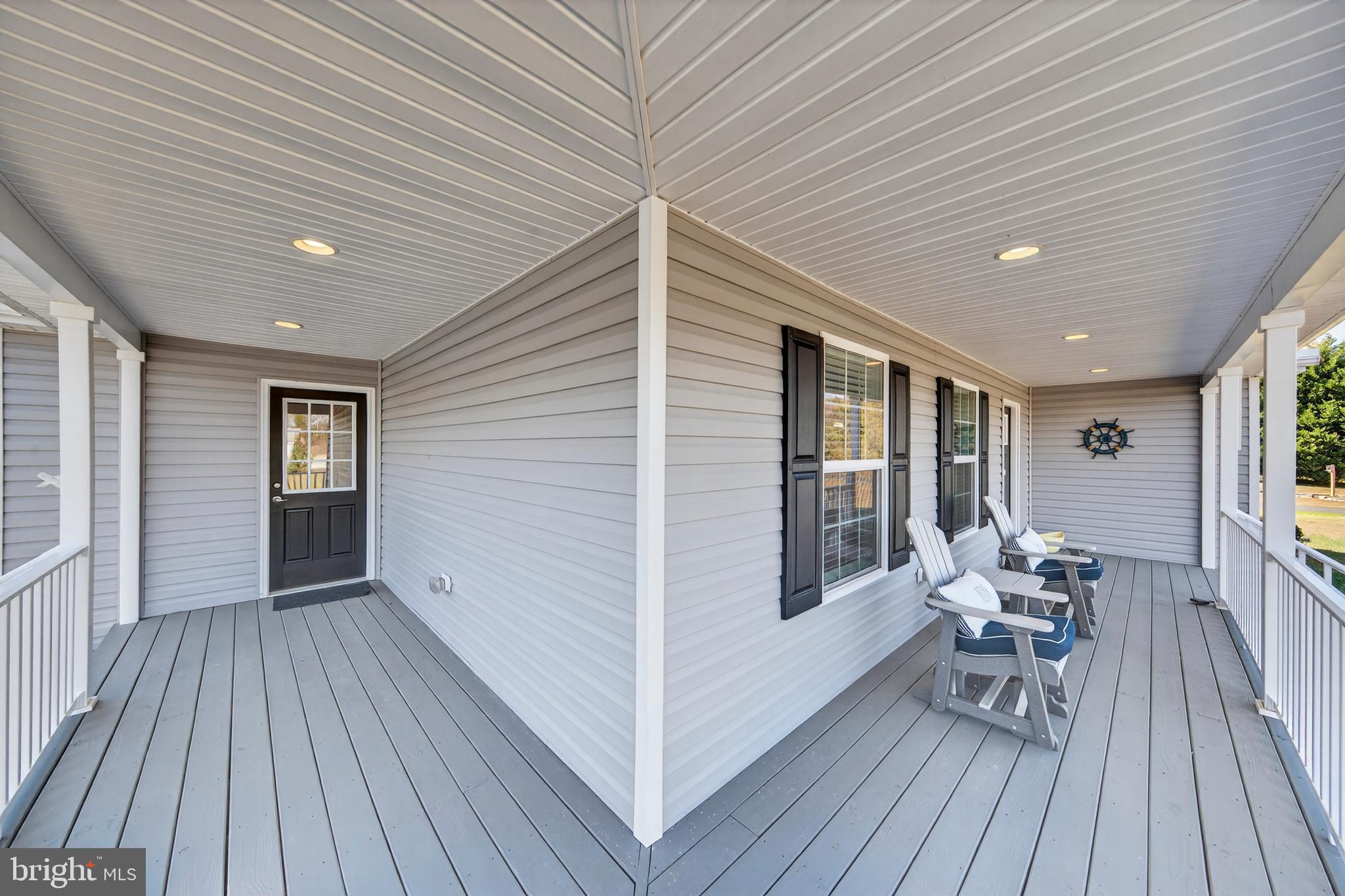 26356 Pennfields Drive Orange, VA 22960 - Photo 43 of 58 a view of a patio with table and chairs and wooden floor