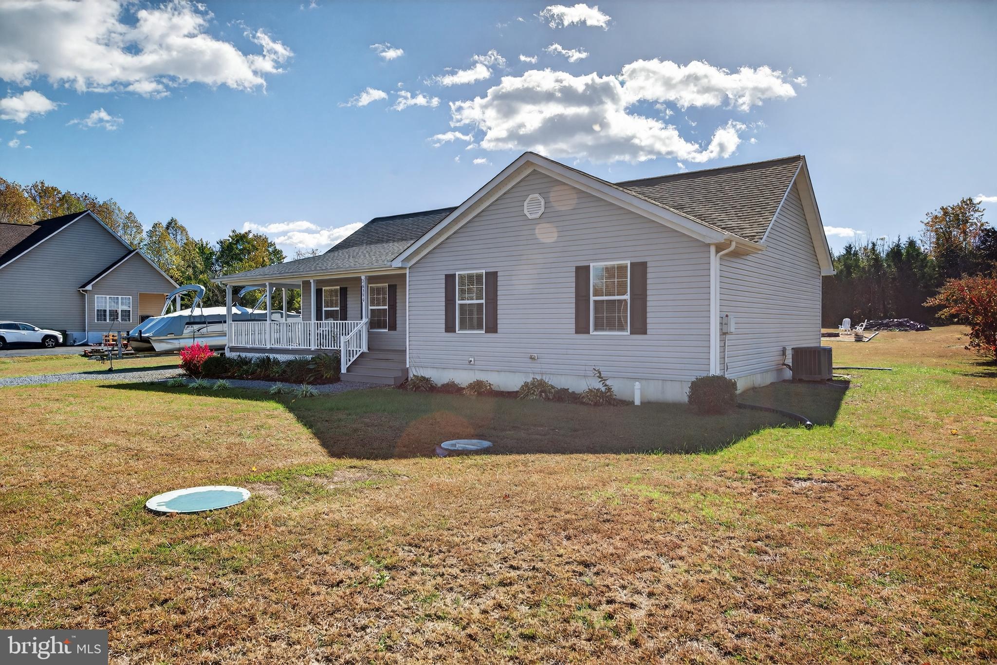 26356 Pennfields Drive Orange, VA 22960 - Photo 55 of 58 a front view of a house with a yard and garage