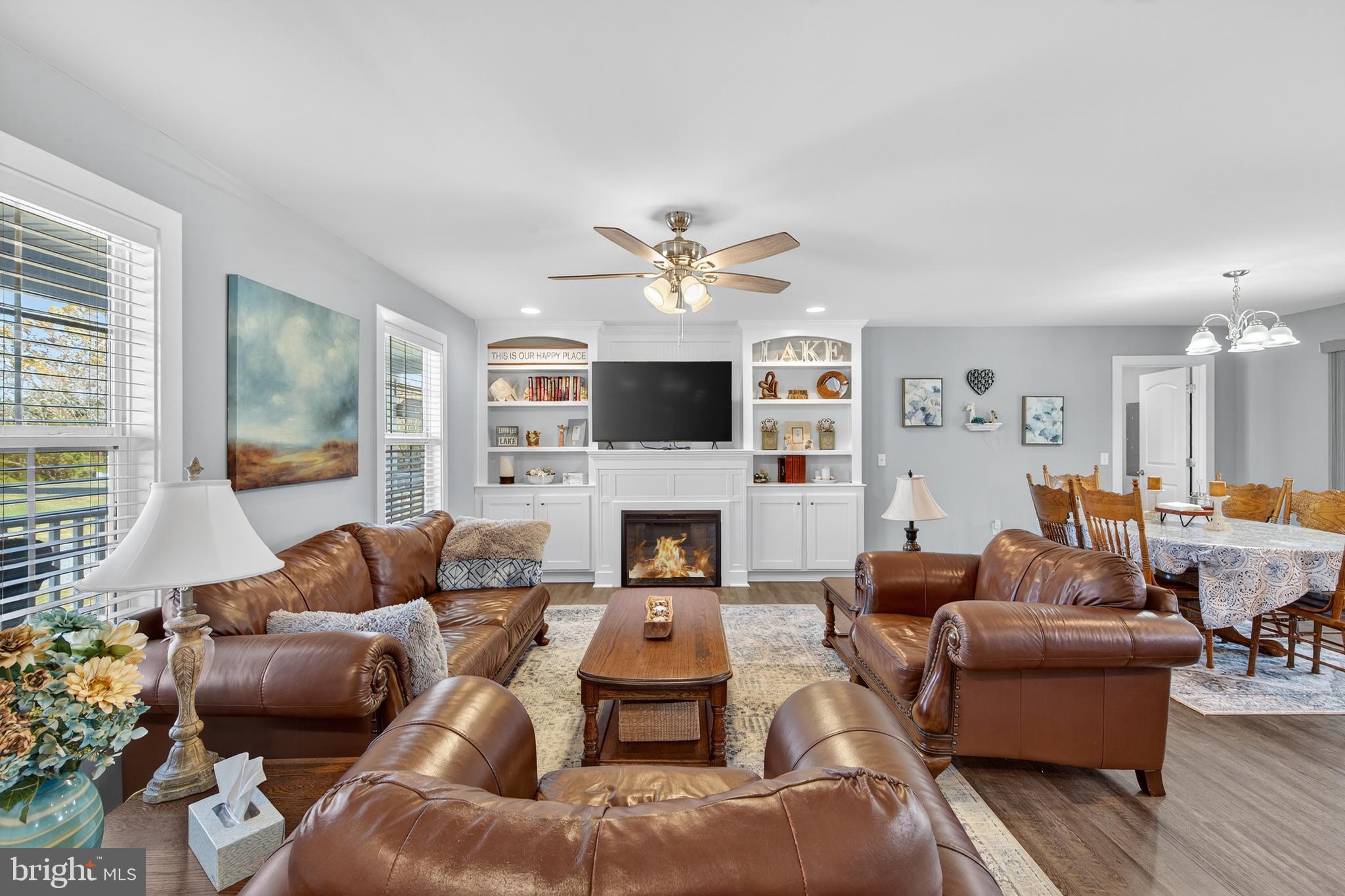 26356 Pennfields Drive Orange, VA 22960 - Photo 10 of 58 a living room with furniture a fireplace and a flat screen tv