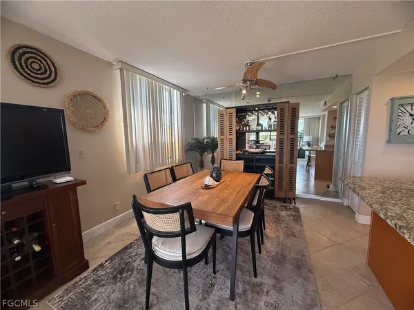a view of a dining room with furniture and window