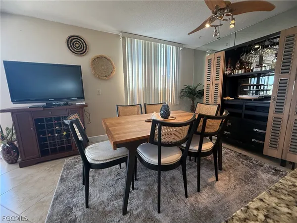 a kitchen with stainless steel appliances granite countertop a refrigerator a stove and a sink