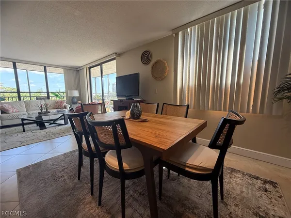 a kitchen with a refrigerator a sink and dishwasher with wooden floor