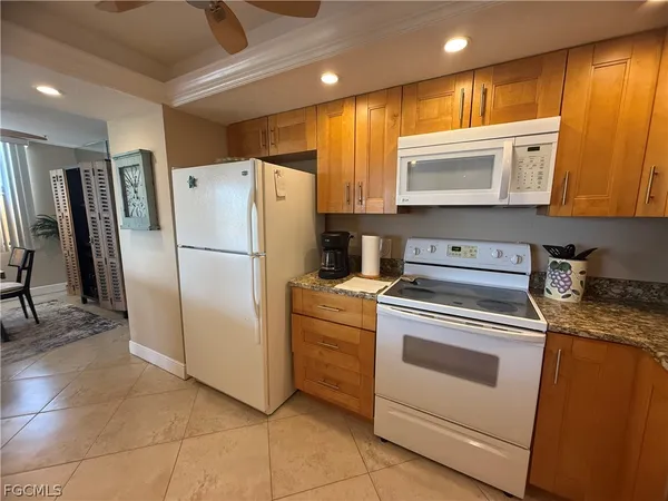 a view of a balcony with lake view and wooden floor