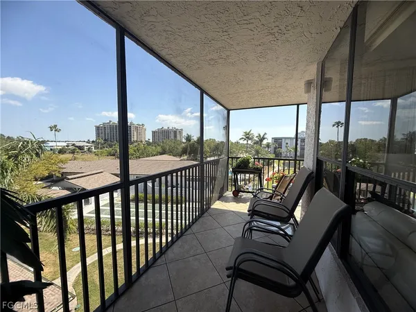 a bedroom with a bed dresser and a window
