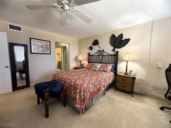 a view of a hallway with wooden floor and windows