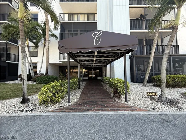 a hallway with a dining table and chairs