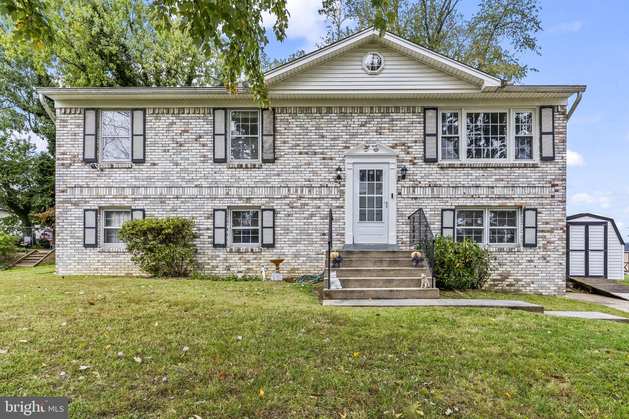 7407 Bellefield Avenue Fort Washington, MD 20744 - Photo 1 of 34 a front view of a house with garden