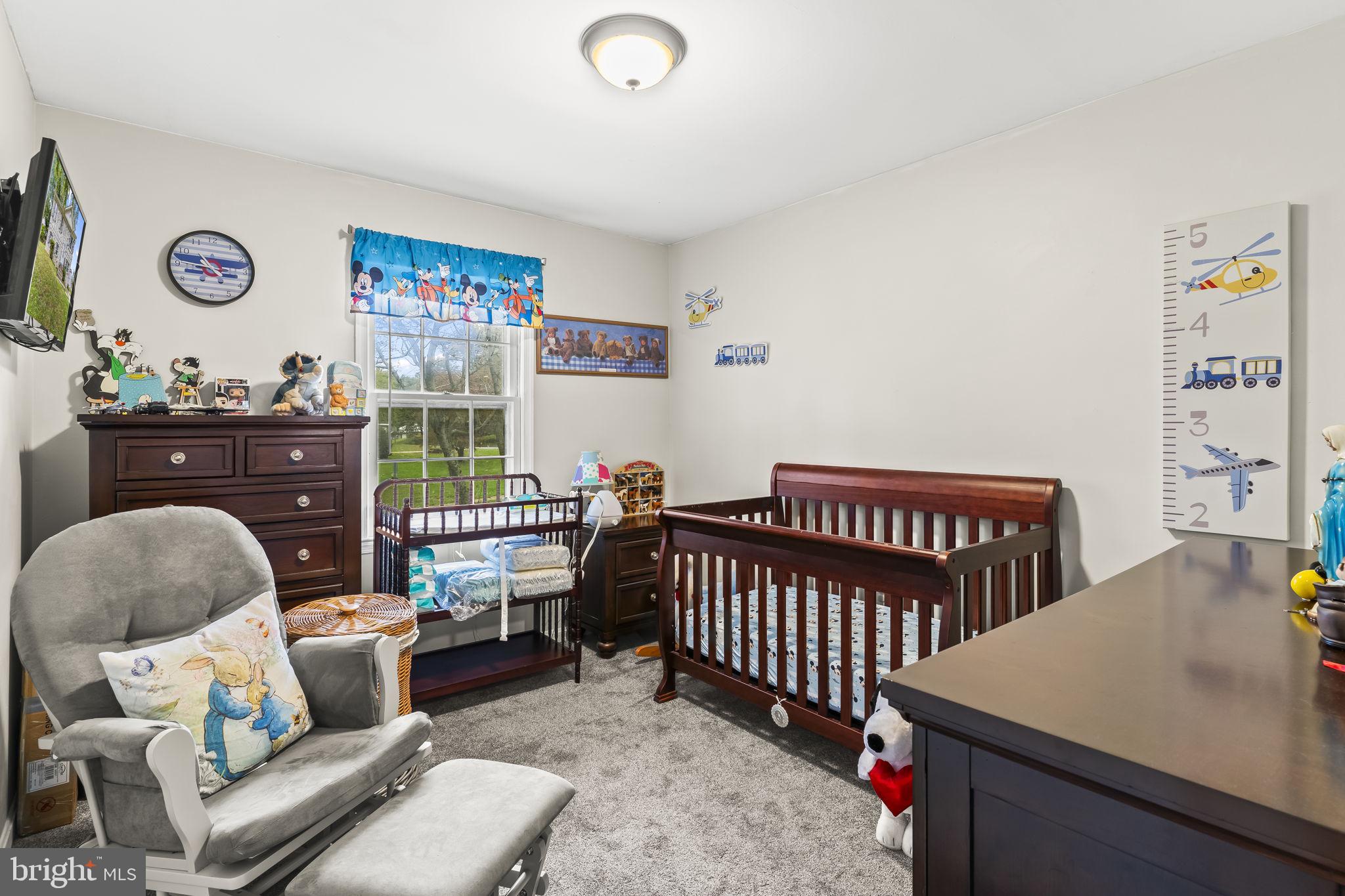7407 Bellefield Avenue Fort Washington, MD 20744 - Photo 15 of 34 a bedroom with furniture and a window