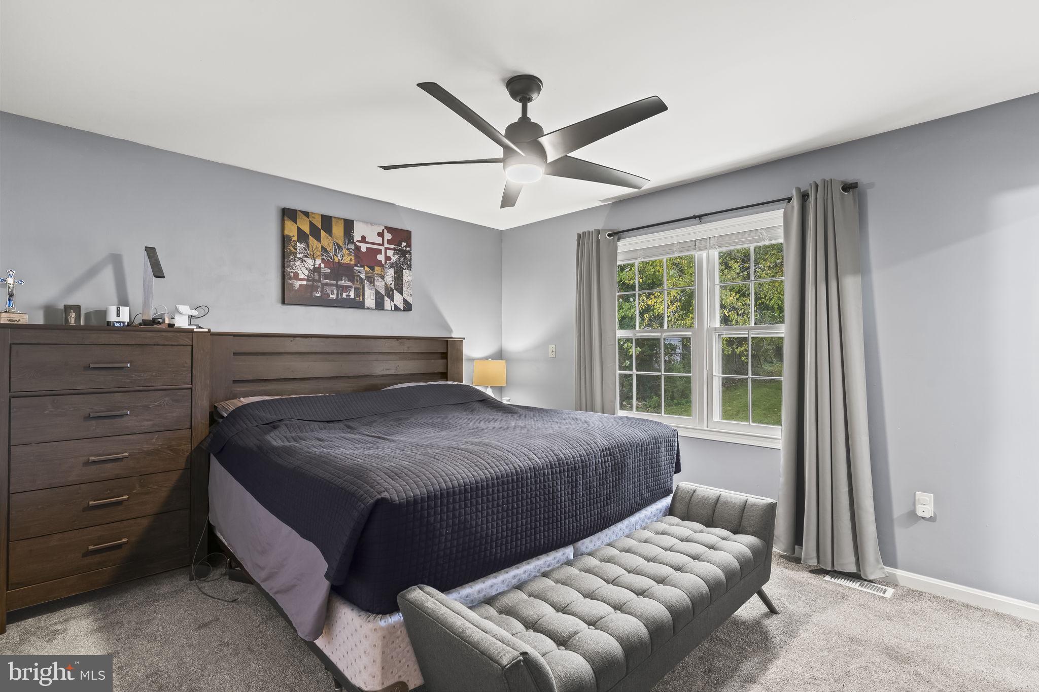 7407 Bellefield Avenue Fort Washington, MD 20744 - Photo 18 of 34 a bedroom with a bed and window