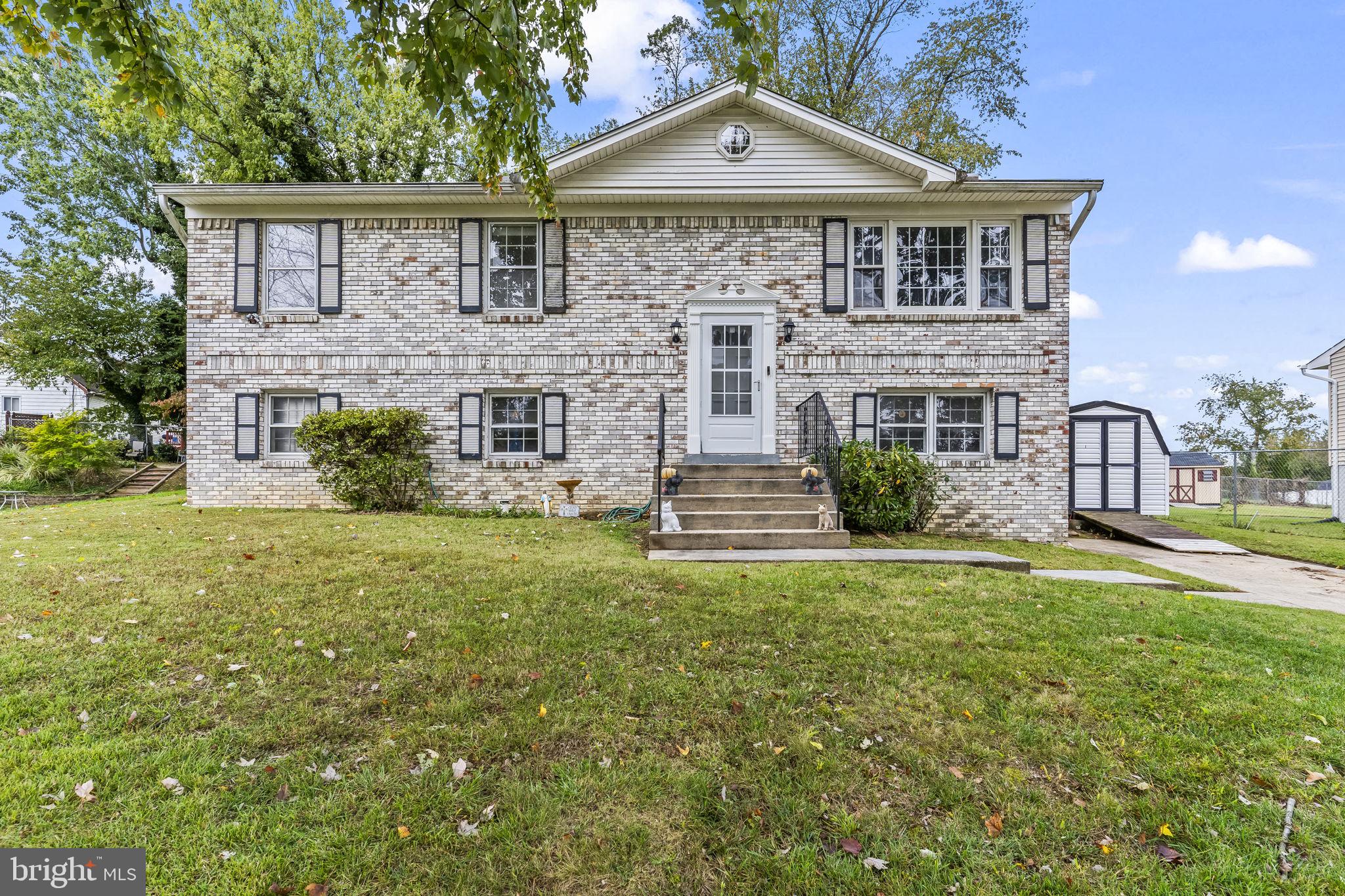 7407 Bellefield Avenue Fort Washington, MD 20744 - Photo 2 of 34 a front view of a house with a yard