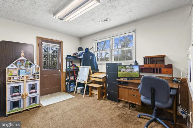 a workspace with furniture and window