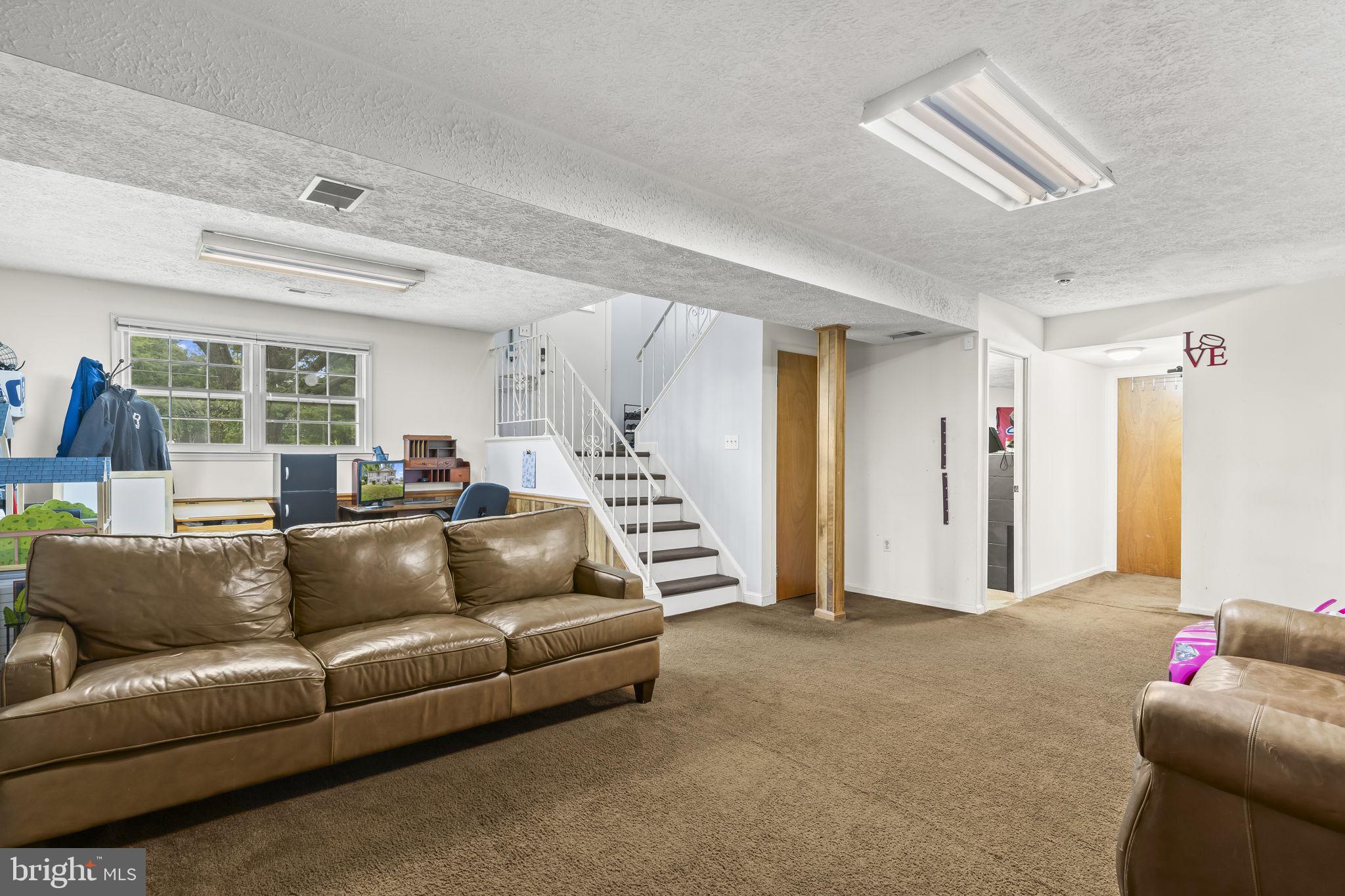 7407 Bellefield Avenue Fort Washington, MD 20744 - Photo 26 of 34 a living room with furniture and a large window