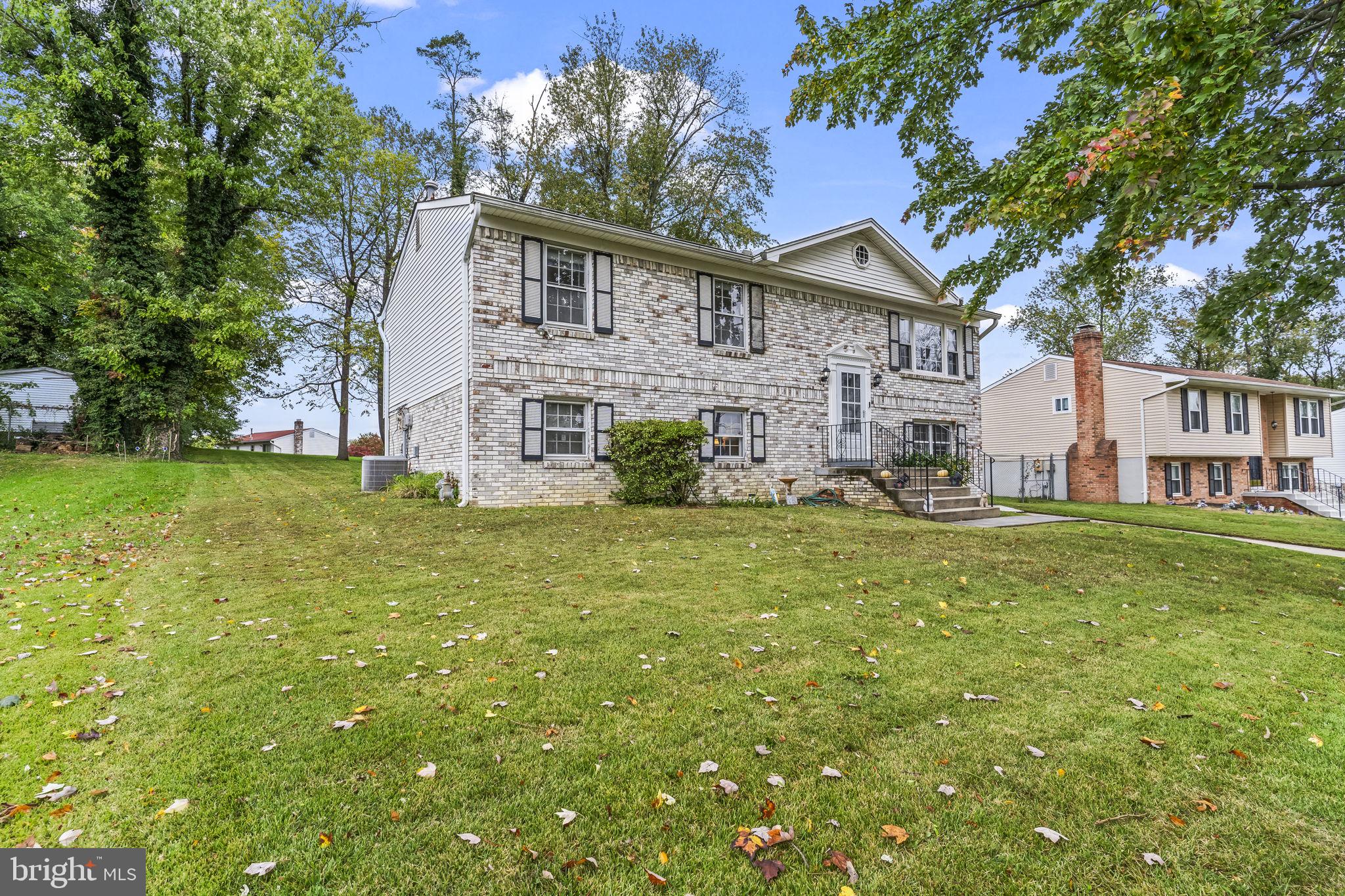 7407 Bellefield Avenue Fort Washington, MD 20744 - Photo 3 of 34 a view of a house with a yard