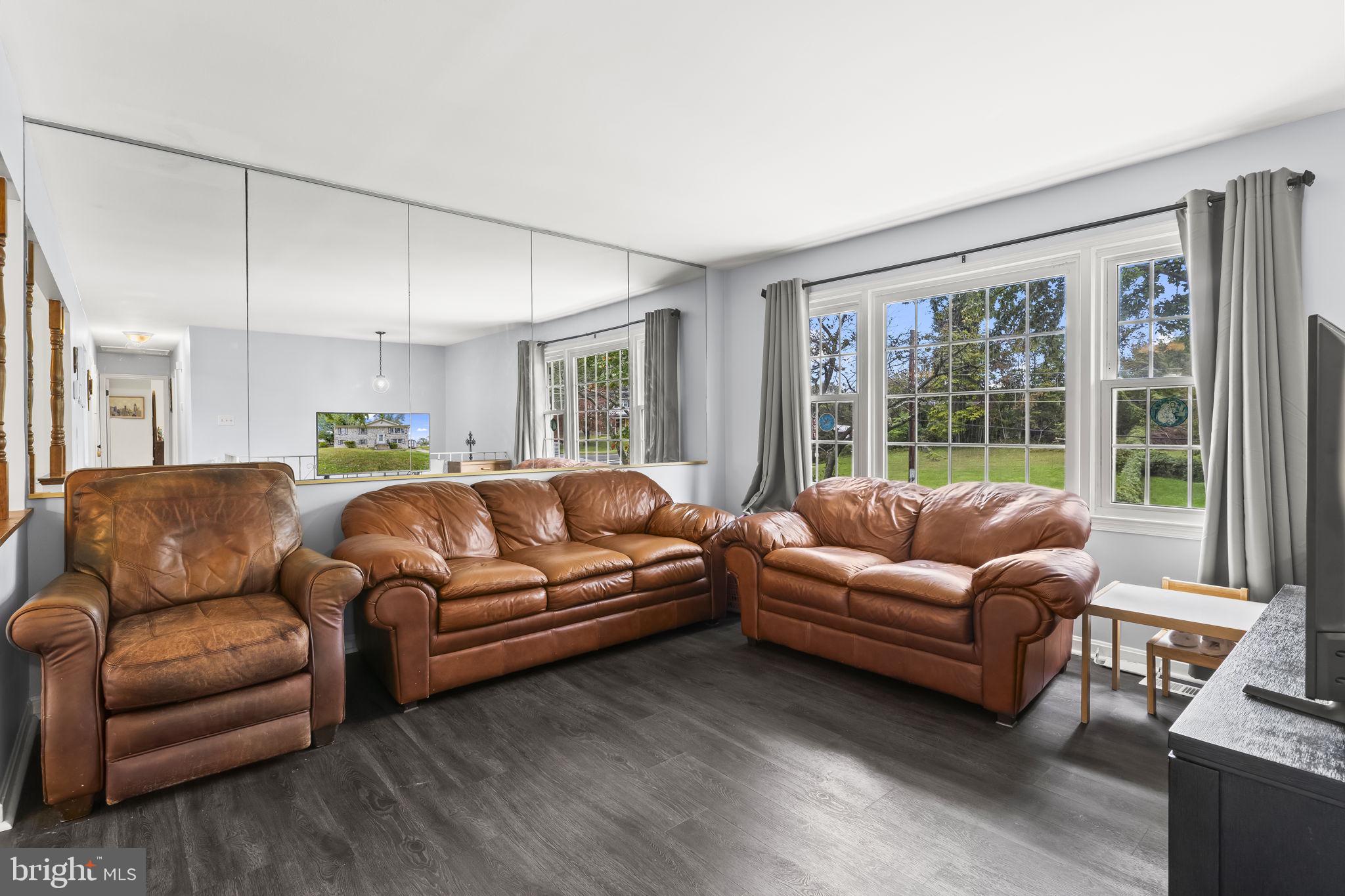 7407 Bellefield Avenue Fort Washington, MD 20744 - Photo 4 of 34 a living room with furniture and a large window