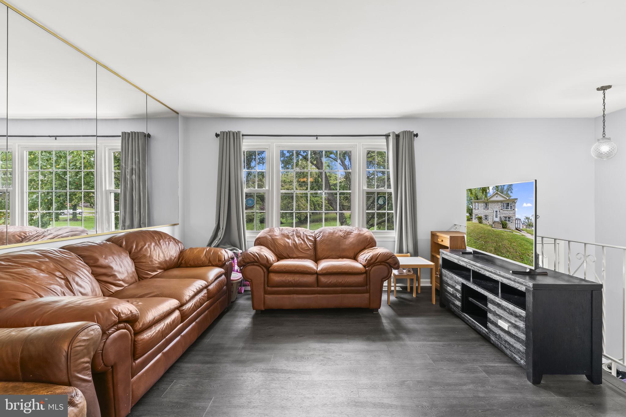 7407 Bellefield Avenue Fort Washington, MD 20744 - Photo 5 of 34 a living room with furniture and a flat screen tv