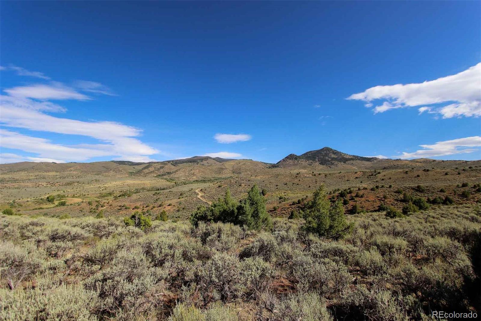 Copper Spur Road Bond, CO 80423 - Photo 27 of 40 a view of a mountain range with lush green forest