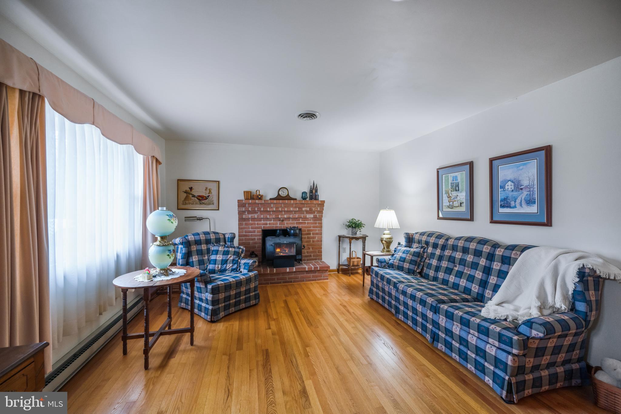 5402 Hines Road Frederick, MD 21704 - Photo 12 of 51 a living room with furniture and a fireplace
