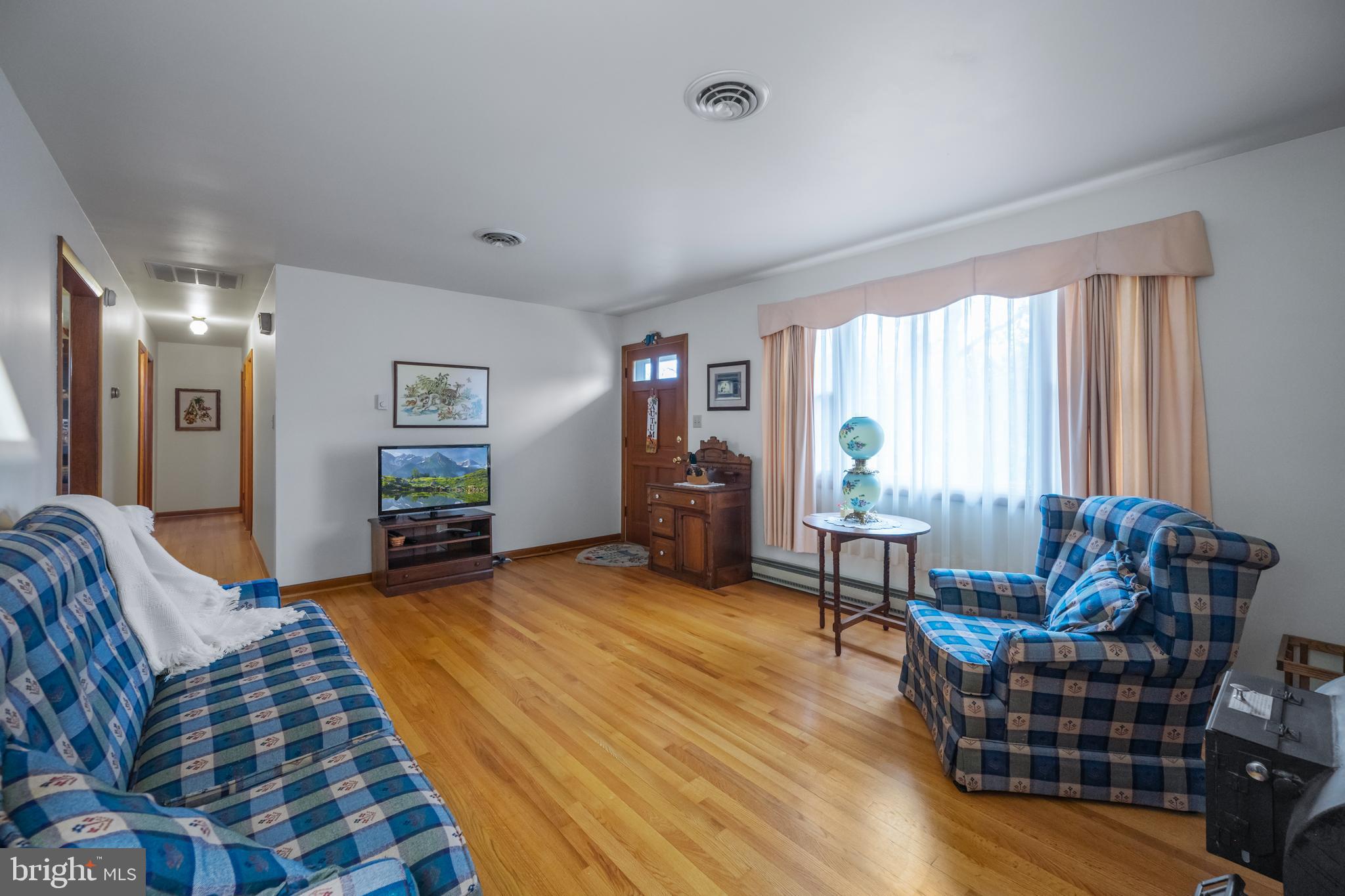 5402 Hines Road Frederick, MD 21704 - Photo 13 of 51 a living room with furniture and a wooden floor