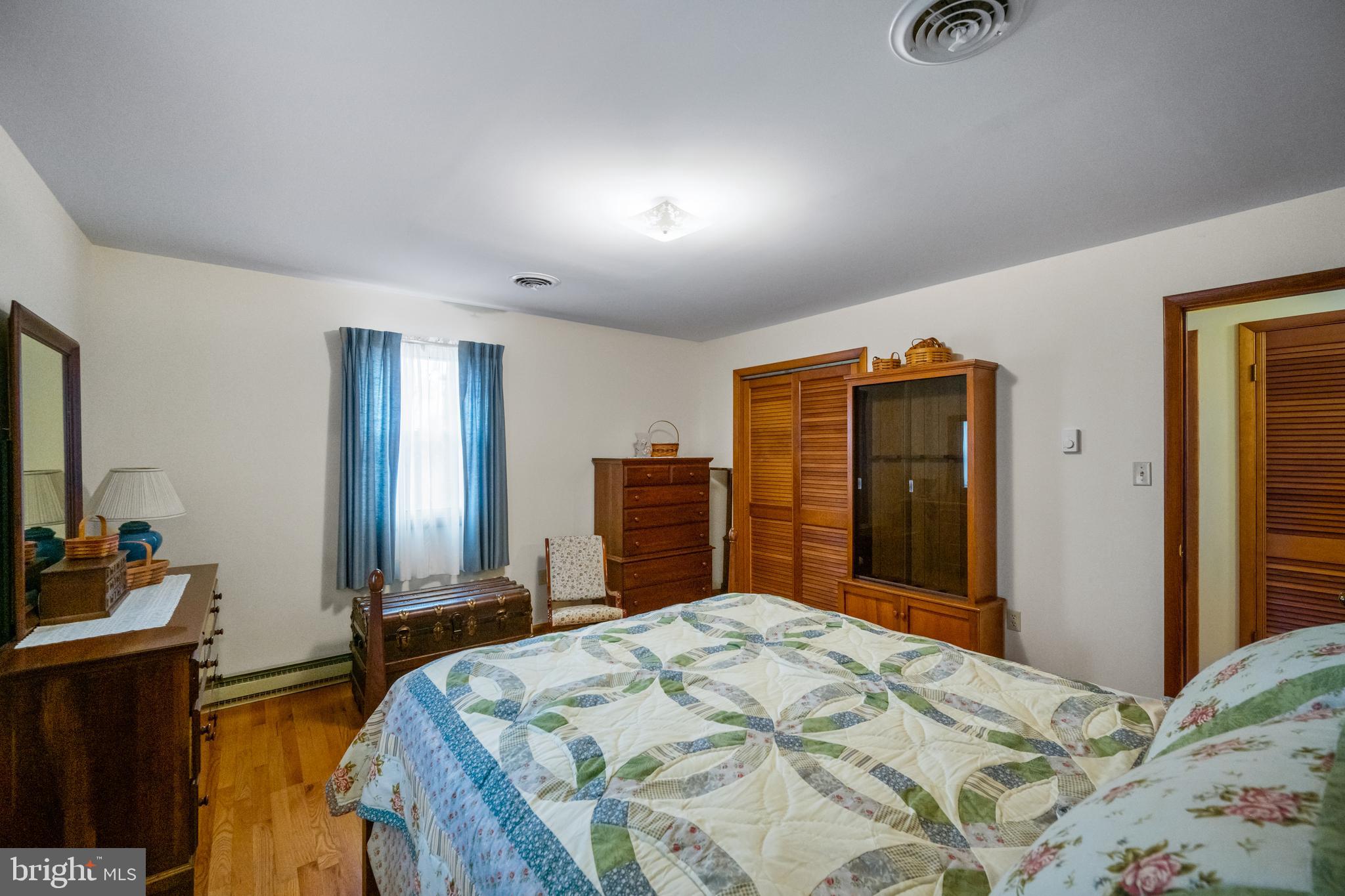 5402 Hines Road Frederick, MD 21704 - Photo 19 of 51 a bedroom with a bed and a dresser in it