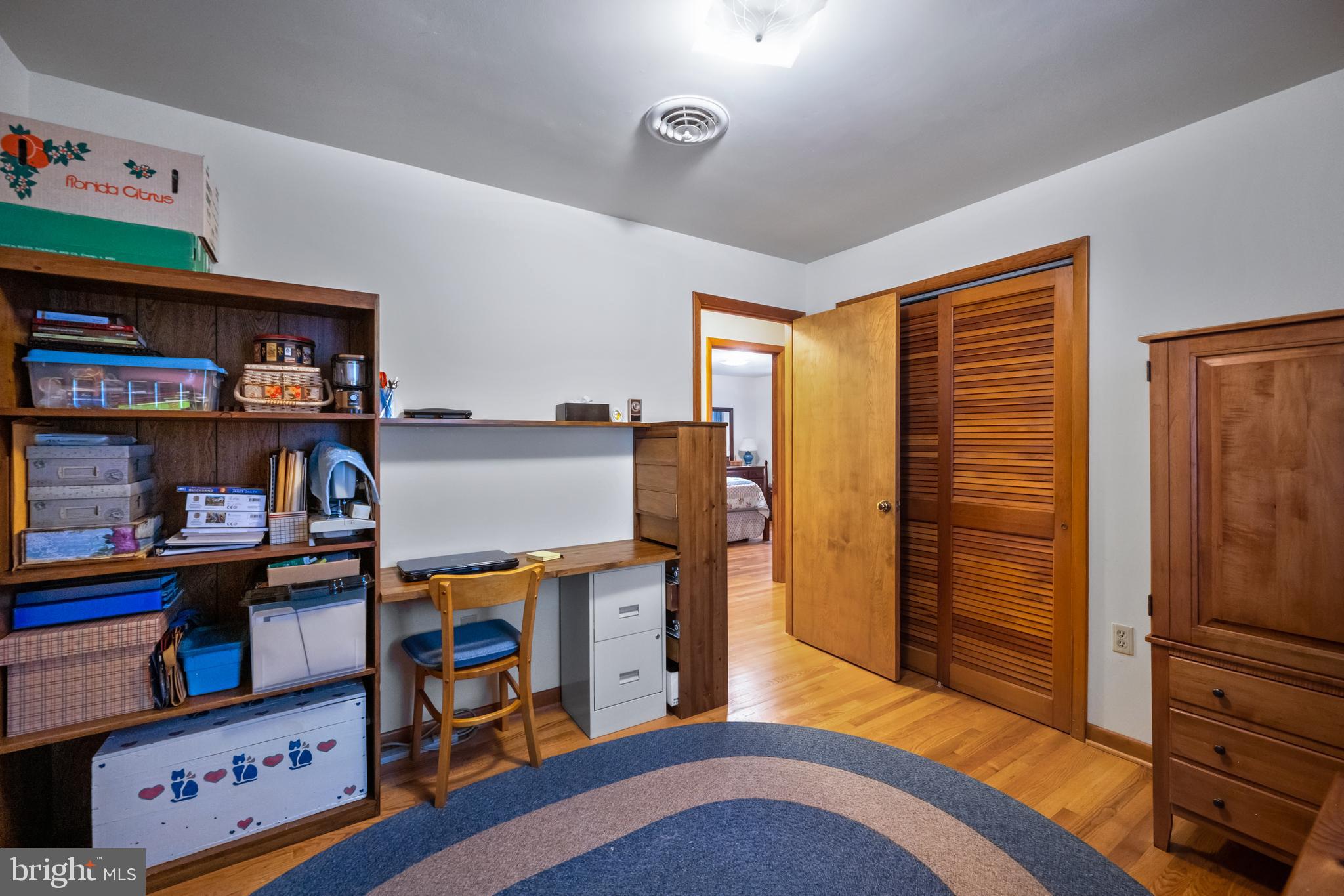 5402 Hines Road Frederick, MD 21704 - Photo 22 of 51 a bedroom with furniture and a book shelf