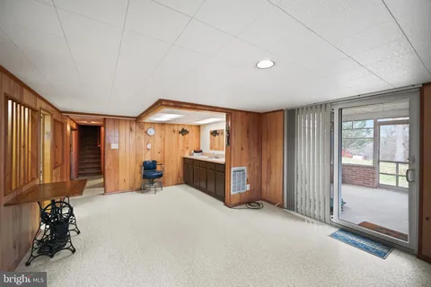 a big room with closet and large windows