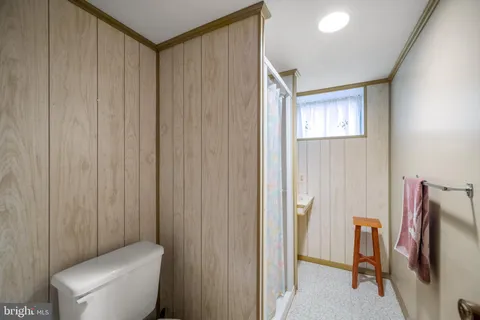 a bathroom with a toilet and a sink