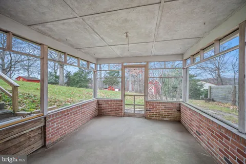 a view of a room with air conditioner and outdoor seating