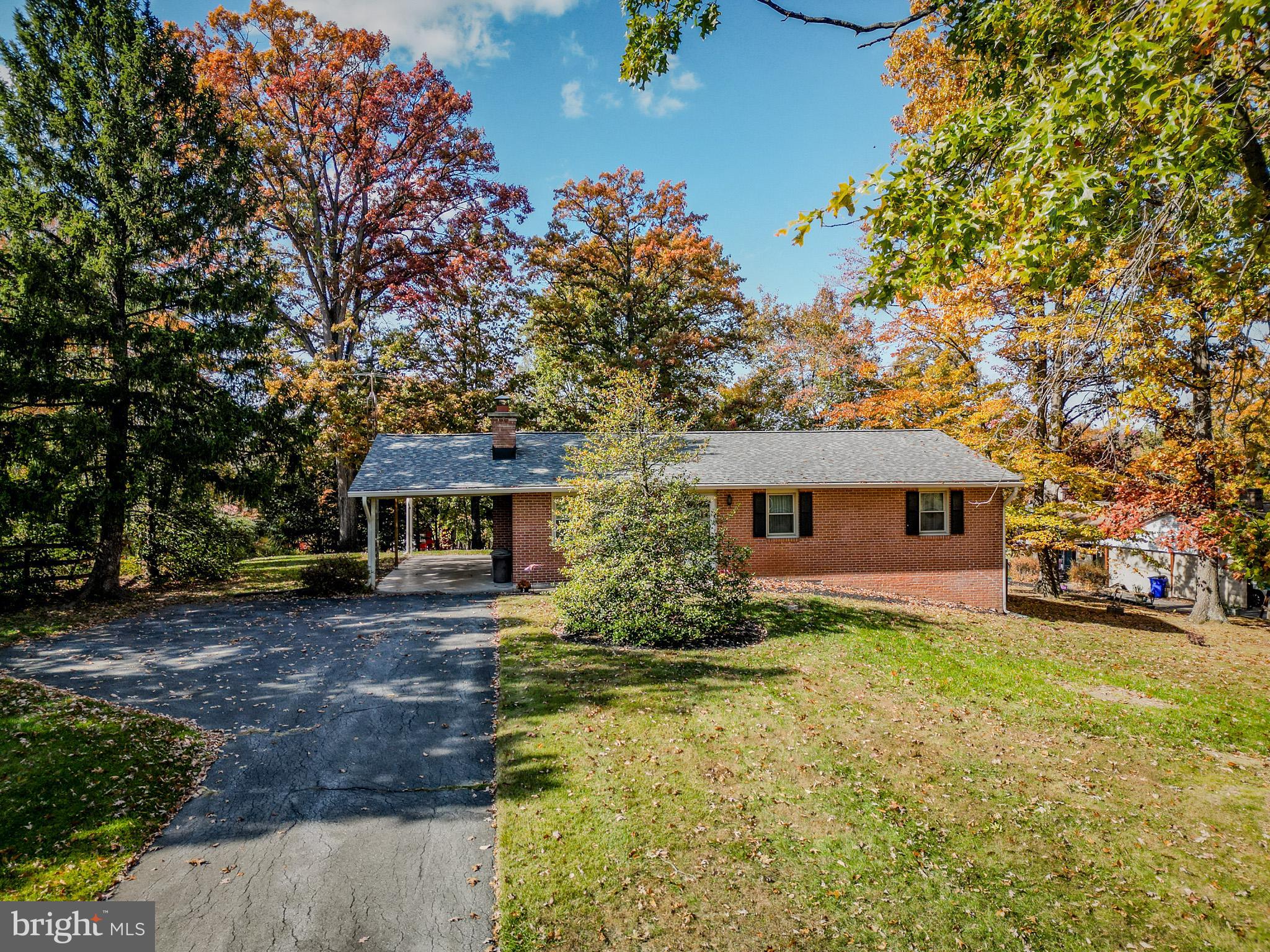 5402 Hines Road Frederick, MD 21704 - Photo 40 of 51 a front view of house with yard and trees around