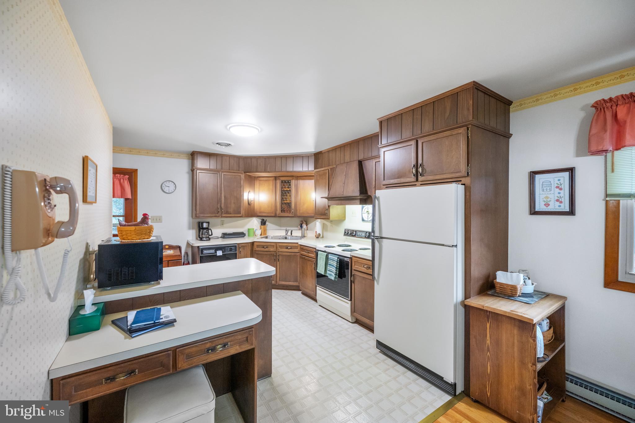 5402 Hines Road Frederick, MD 21704 - Photo 5 of 51 a kitchen with stainless steel appliances a refrigerator sink and wooden floor
