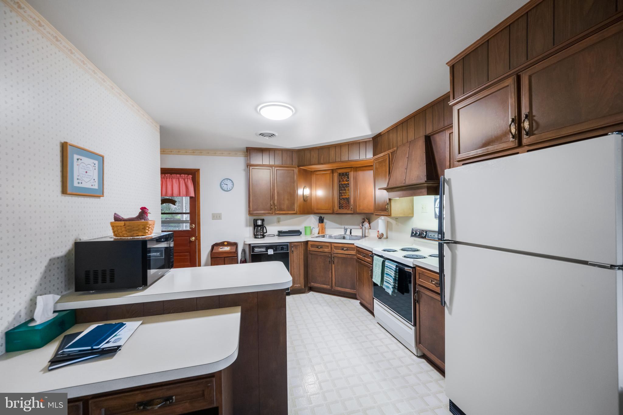 5402 Hines Road Frederick, MD 21704 - Photo 6 of 51 a kitchen with stainless steel appliances granite countertop a refrigerator a sink dishwasher a stove and a refrigerator with wooden floor