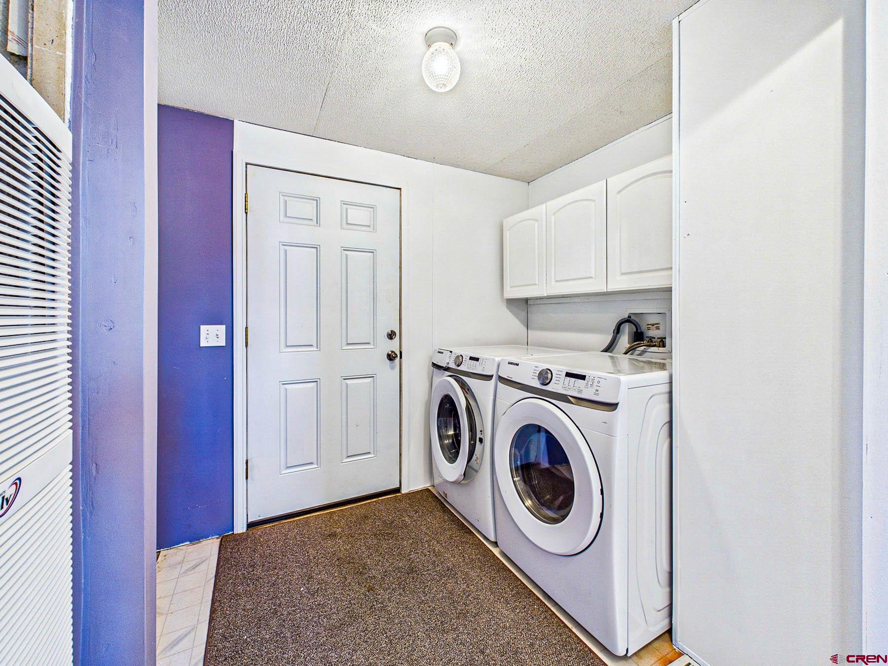 17199 2550th Road Cedaredge, CO 81413 - Photo 6 of 38 a utility room with dryer and washer
