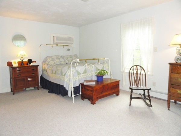 61 Coldbrook Road Oakham, MA 01068 - Photo 11 of 30 a bedroom with a bed chair and dresser
