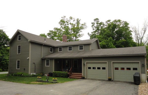 61 Coldbrook Road Oakham, MA 01068 - Photo 2 of 30 a front view of a house with garage