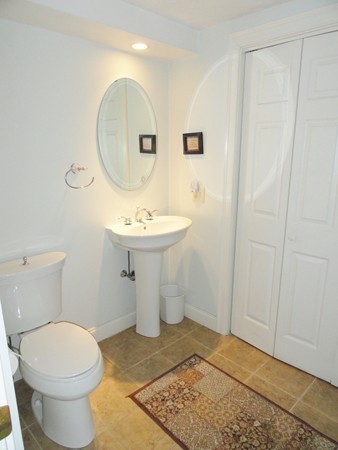 61 Coldbrook Road Oakham, MA 01068 - Photo 21 of 30 a bathroom with a sink toilet and mirror