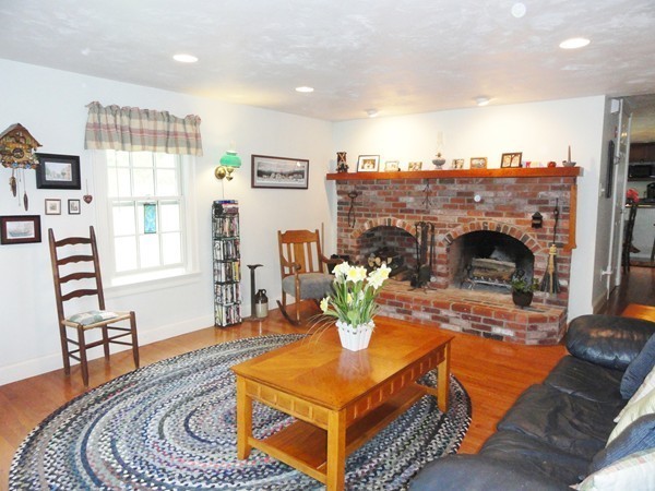 61 Coldbrook Road Oakham, MA 01068 - Photo 4 of 30 a living room with furniture and a fireplace
